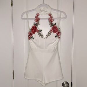 Beautiful, one piece romper with a floral design